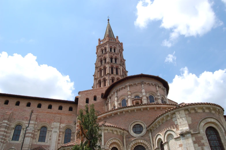 a cathedral designed in stone with a sky background