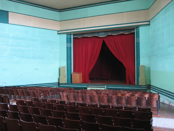 an empty theater with rows of empty seats