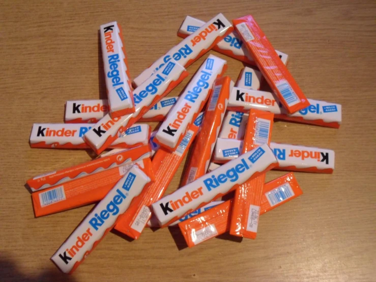 small bars of kinder and sugar with one smaller one behind it