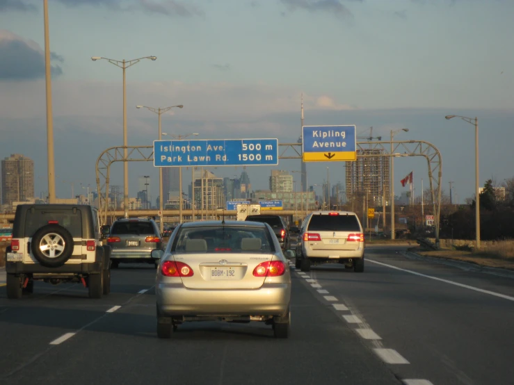 a group of cars on a highway going around different lanes