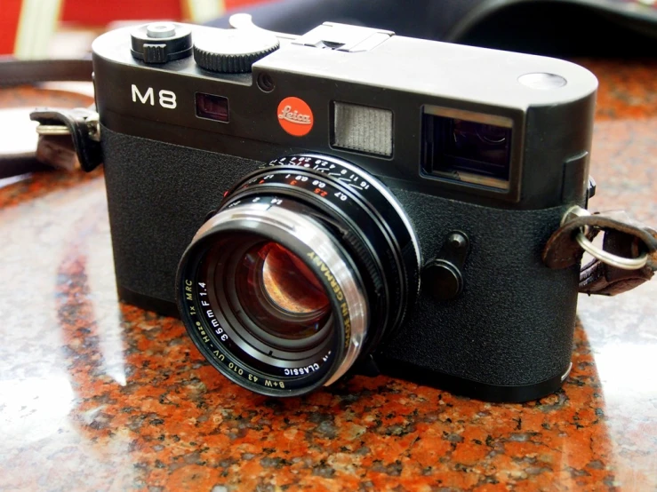 an old camera on a counter is seen