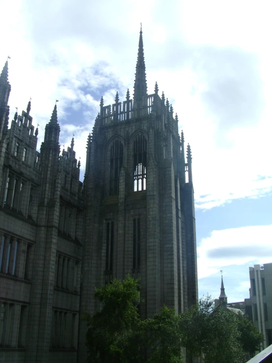 large stone building with spires in a city