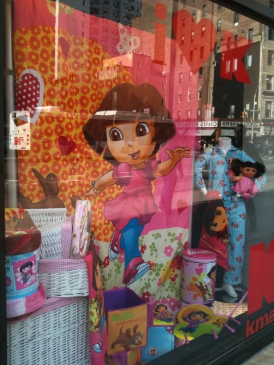 a store window display with children's toys behind it