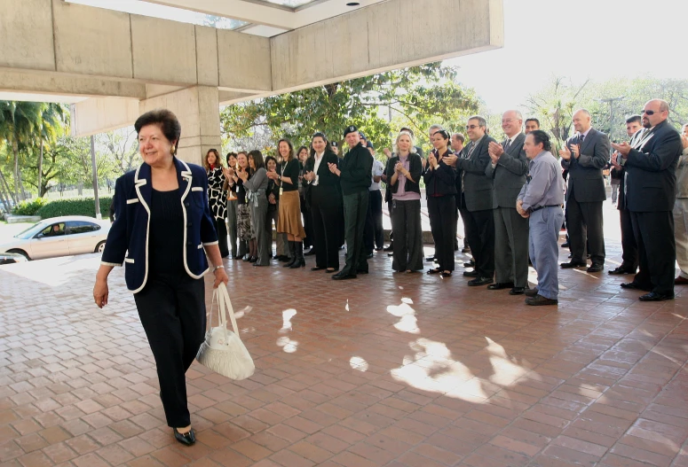 a woman walking away from a group of people