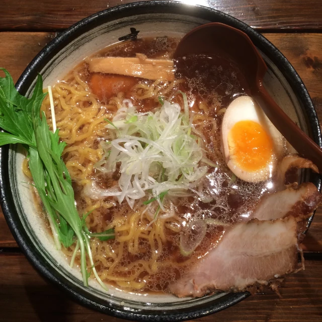 a close up of a bowl of food on a table