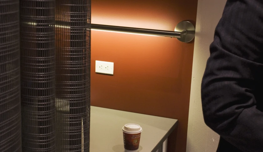 coffee cup on table in corner of room