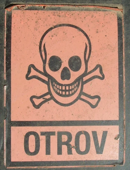 a pink sign with a skull on it