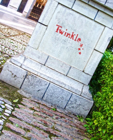 a statue with graffiti on it in front of a building