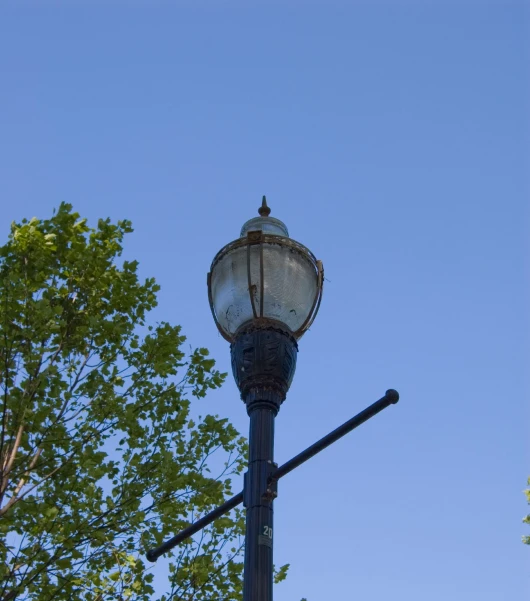 a street light with a clear blue sky above