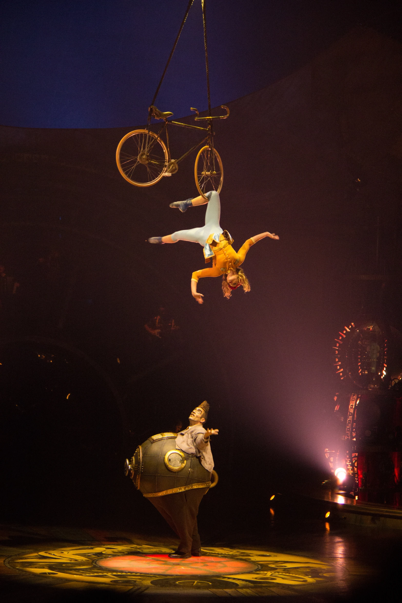 two people on the ground performing tricks at an event