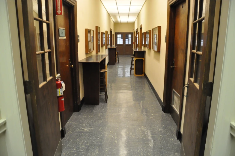 long corridor with chairs and tables in a building