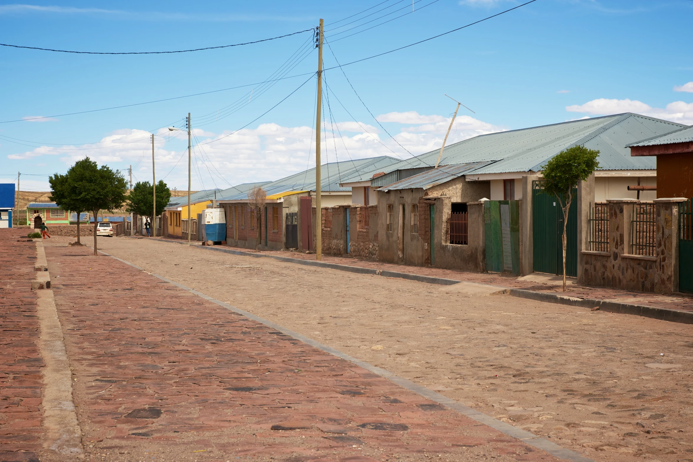 a cobblestone street in a small rural town