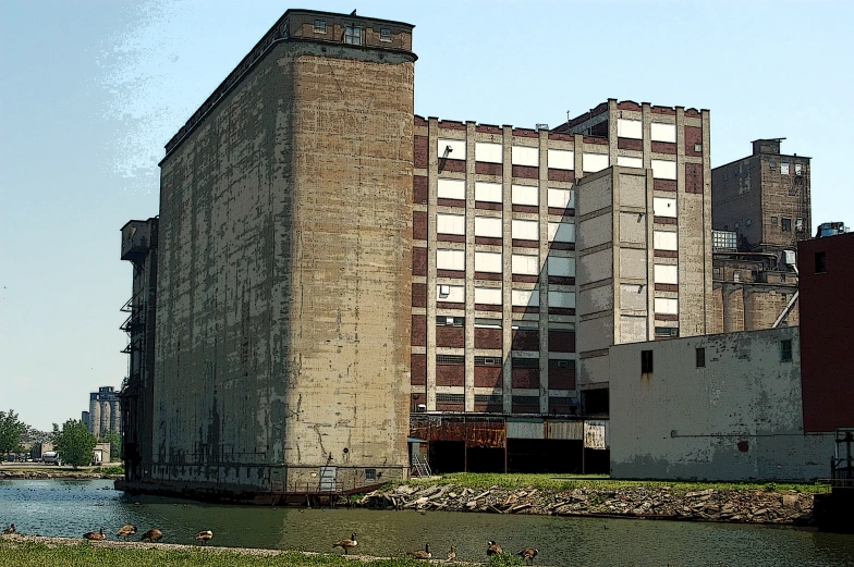 the old buildings are near a small river