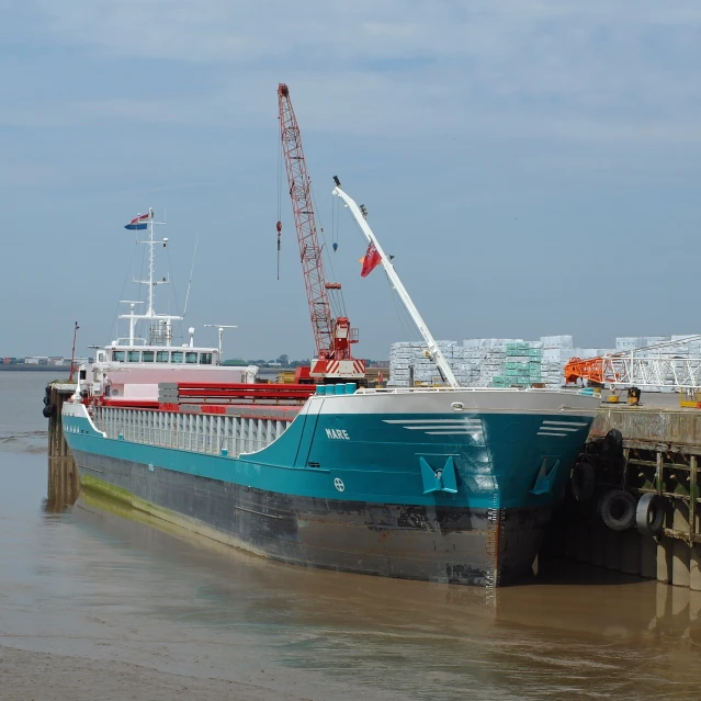 a boat is docked at a pier next to a dock