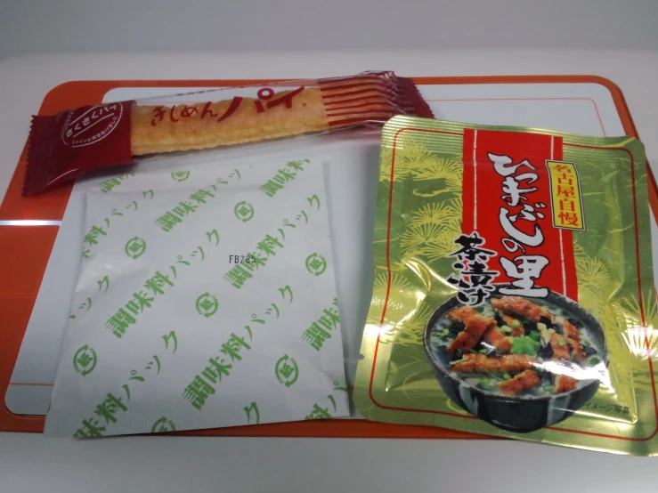 a chinese dish sits next to an in - bags bag