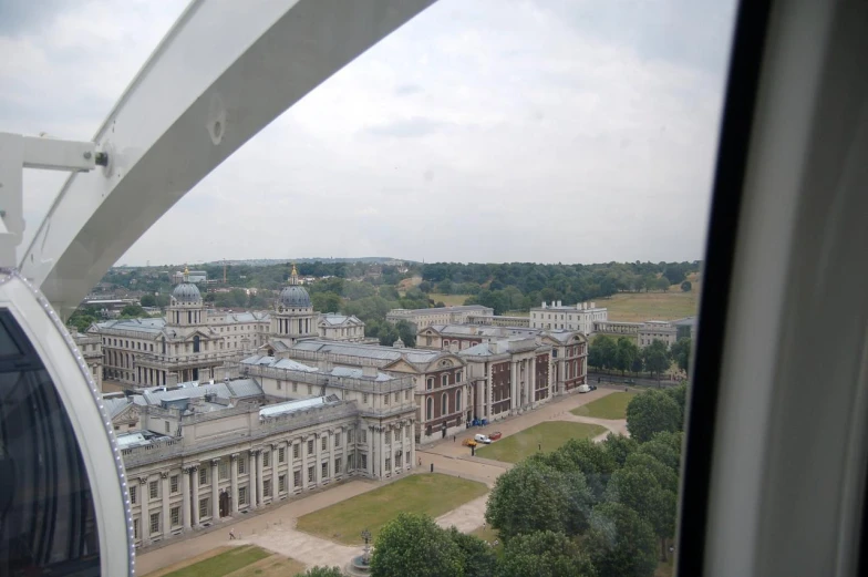 the top part of a building with several buildings in the background