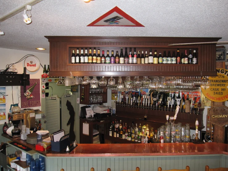 the large bar has many empty bottles on it