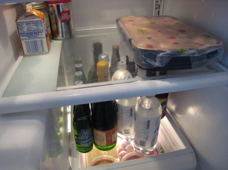 a view of the inside of a refrigerator that has drinks and drinks in it