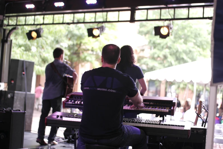 people are in front of an electric keyboard