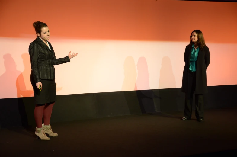 a couple of women standing next to each other