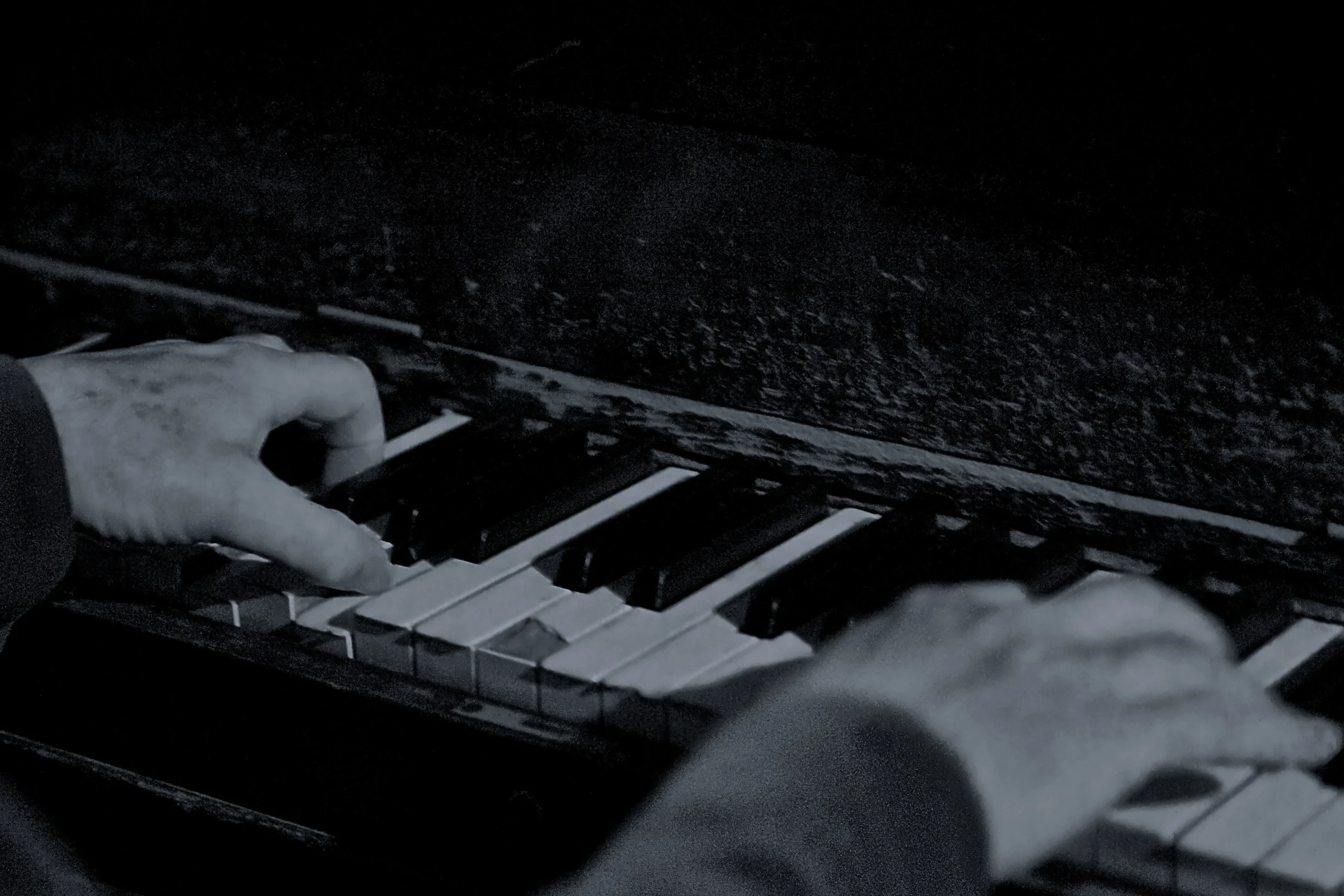 a man is playing an organ outside at night