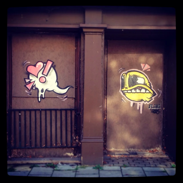 two doors are shown, with some graffiti on the walls