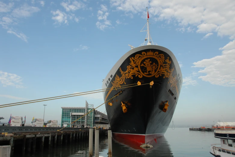 the large ship is docked in the water