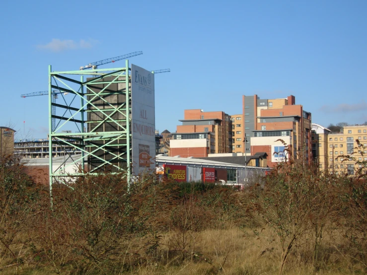 a big industrial area with some tall buildings in the background