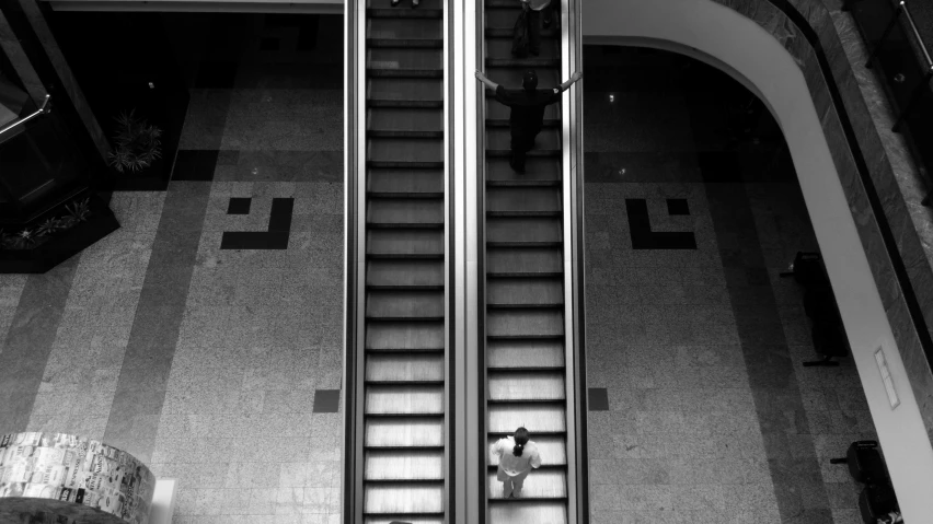 a man standing at the bottom of a set of stairs