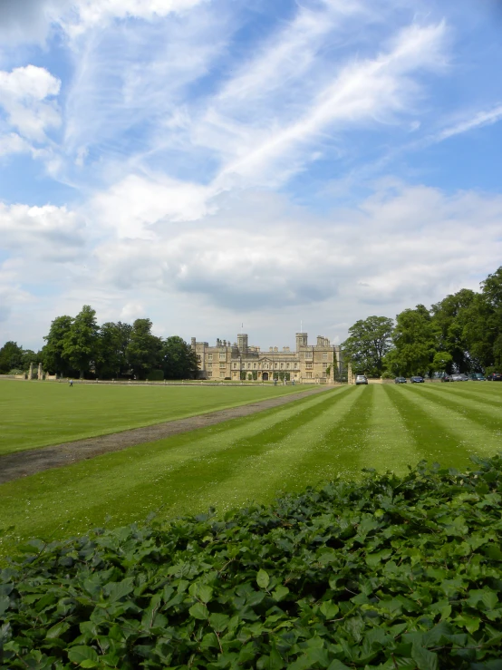 a building in the distance with a blue sky in the background