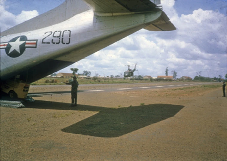 a big old military plane on the ground