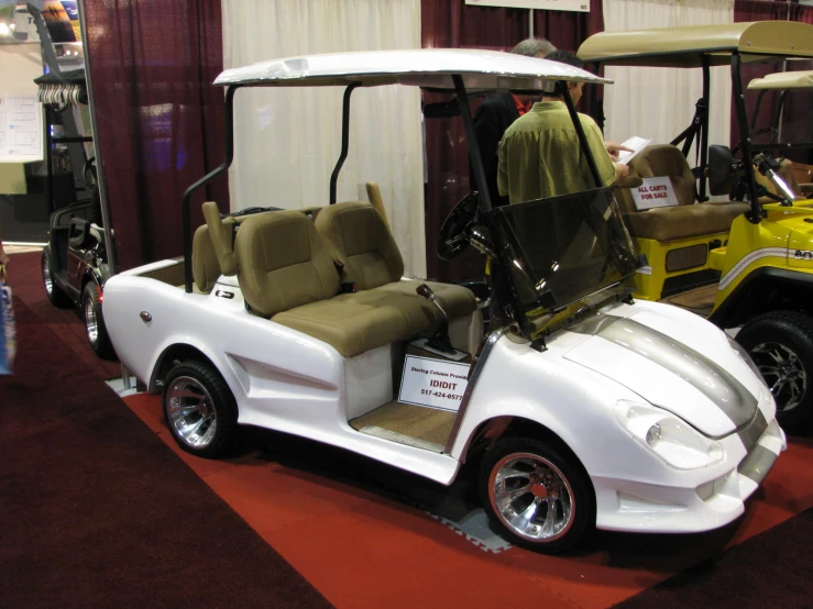 a car with a side cart is on display