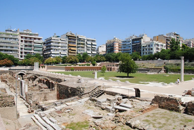 ruins in a park near large apartment buildings