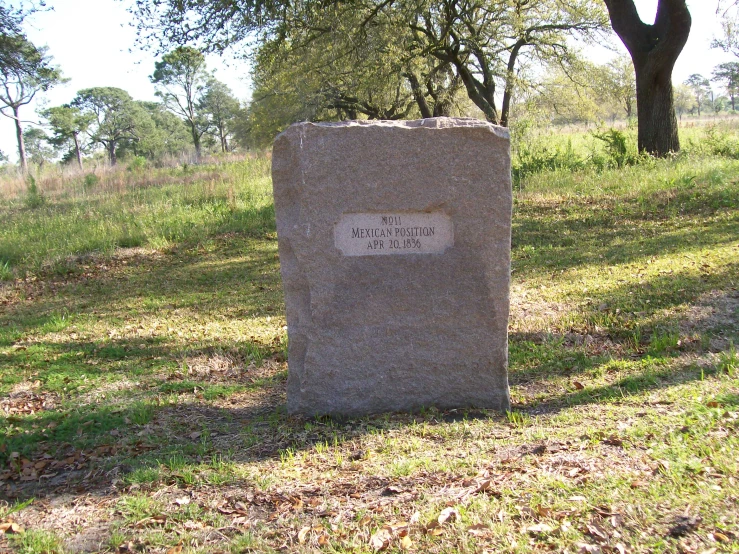 a monument that reads hope sits in the grass