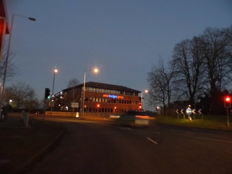 a car is speeding past a stop light