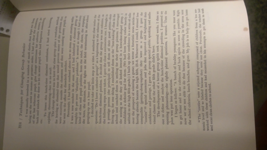 a close up of an opened book with writing on it