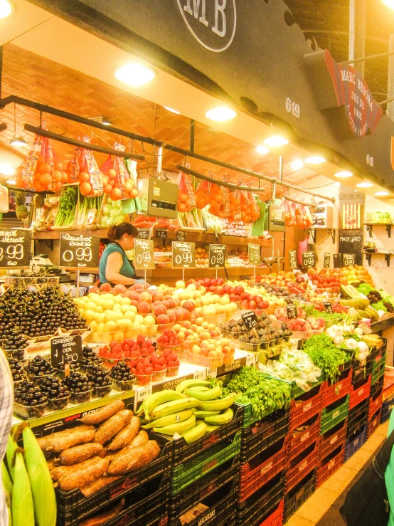 a market area with shelves, fruits, vegetables and people