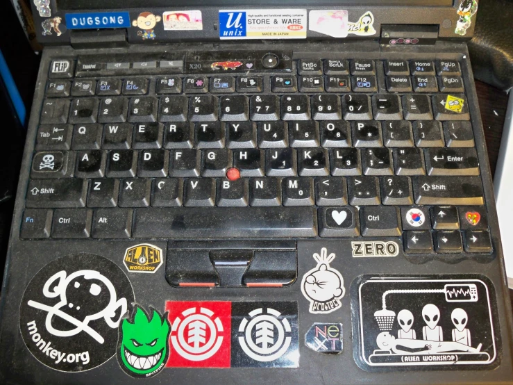 some stickers on the side of a laptop