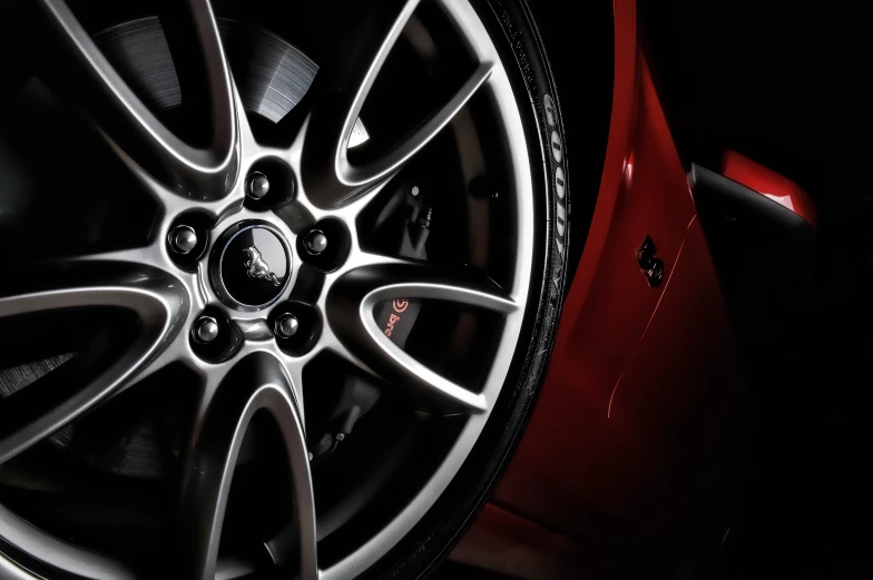 a wheel on a car in the dark