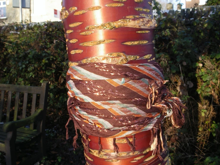 a large long stack of items with different ropes hanging on it