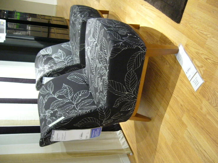 the black and white floral patterned chair with its price tag