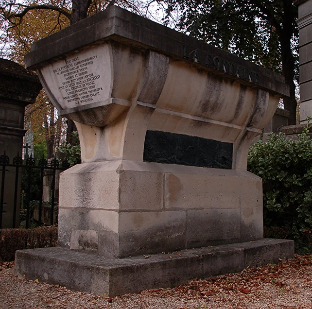 an ornate monument is in a park setting