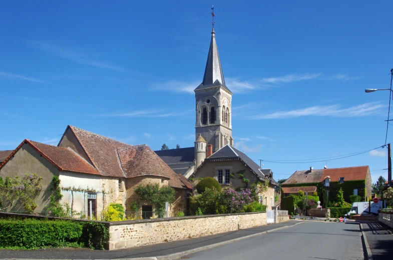 a church sitting in the middle of some homes