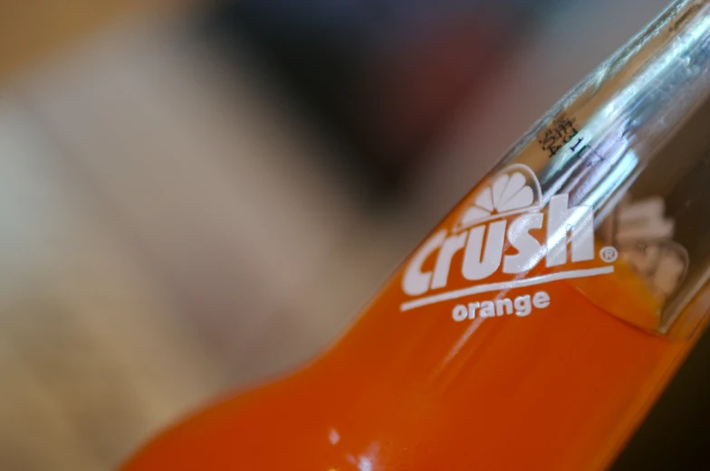 the close up of an orange crush drink bottle