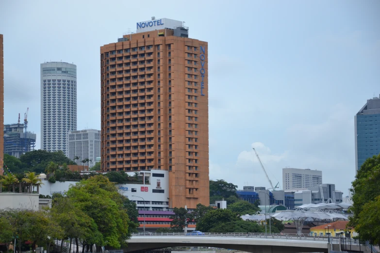 large building near a river in city with tall buildings