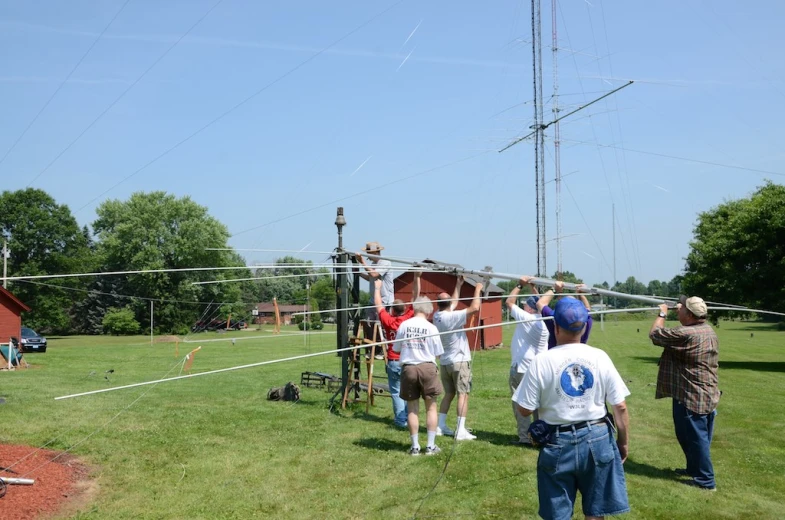 men stand in a line to play volley ball