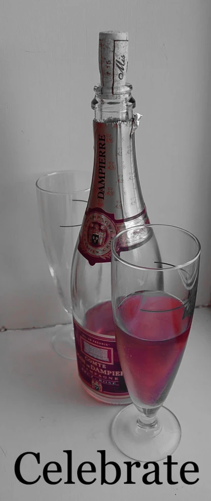 a wine glass and a bottle are featured in this image