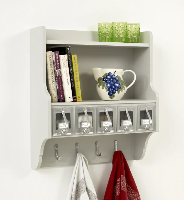 the shelf on the wall is organized with towel hooks