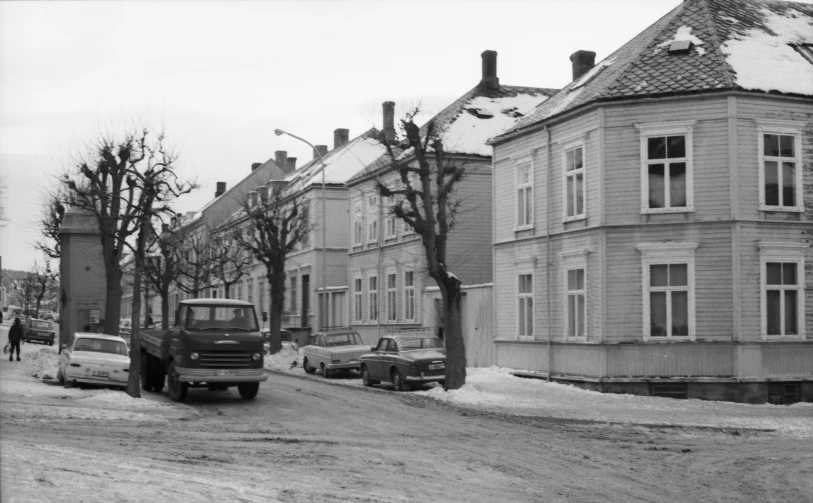 black and white pograph of old style buildings in winter