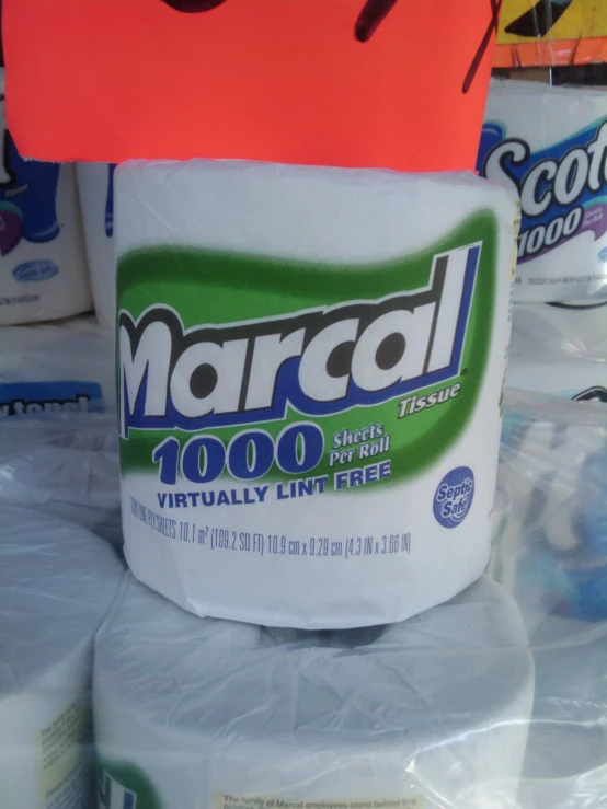 a large roll of white toilet paper with a marpacal ad on it